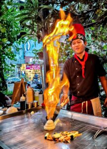 Hands-on hibachi cooking masterclass led by Chef Danny in Bali, teaching professional live-fire culinary skills to aspiring chefs.